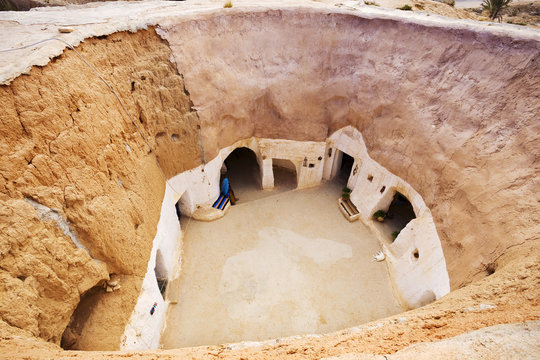 Tunisia. Matmata - the largest region of the troglodyte communities. One of many dwellings - fragment of courtyard excavated in the rock (circular crater a few meters deep)