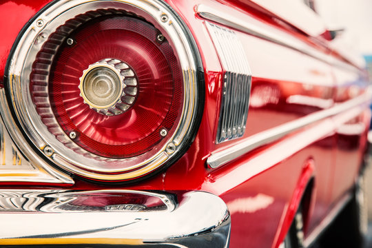 Photograph of classic car with close-up on taillights