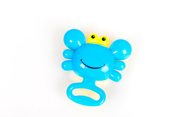 Colorful rattle in the form of a crab on a white background, toys for children, voiced toy