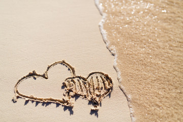 Hearts drawn on beach