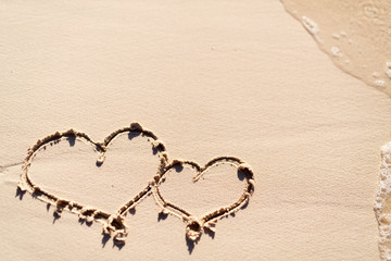 Hearts drawn on beach