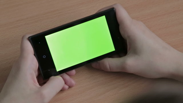 Female Hands Using Cell Phone, Green Screen