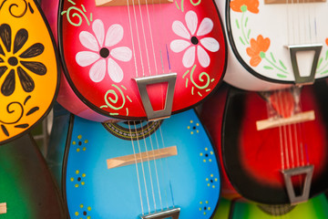 Colorful traditional mexican guitars on market. Great for background