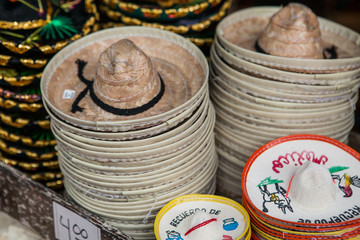 Colorful sombreros for sale at a market in Mexico.