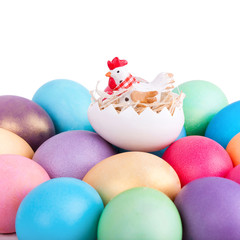 Chicken toy on easter eggs closeup