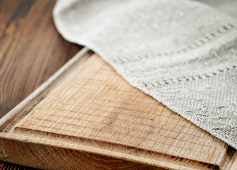 wooden cutting board and linen napkin