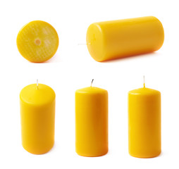 Single yellow wax candle isolated