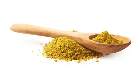 Pile of yellow curry seasoning isolated