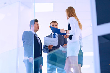 Fototapeta premium Group of business people doing presentation with laptop during meeting