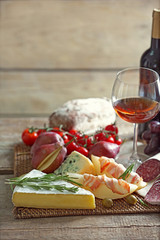 Still life with various types of Italian food and wine