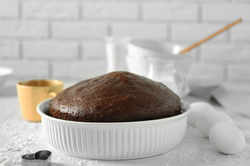 Cooked chocolate pie in a baking tray on a table