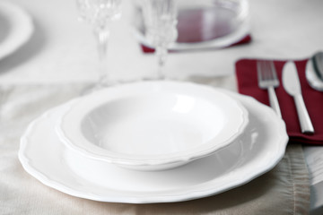 Table set at restaurant on light background