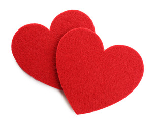 Red felt hearts isolated on white background