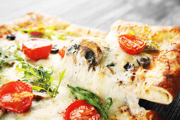 Piece of freshly homemade pizza closeup