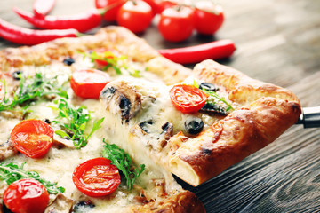 Piece of freshly homemade pizza closeup