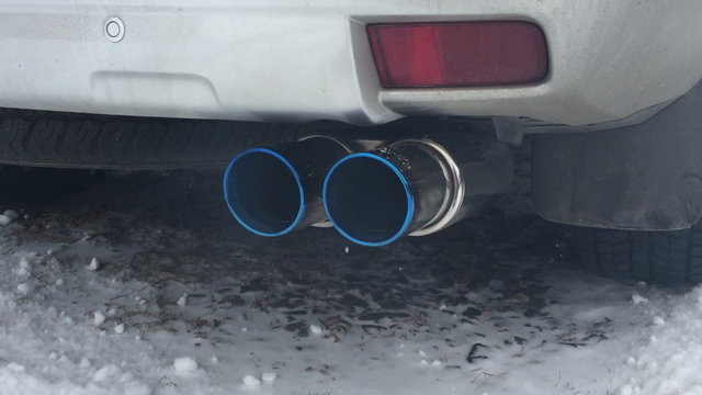 Exhaust gases from the muffler running car.