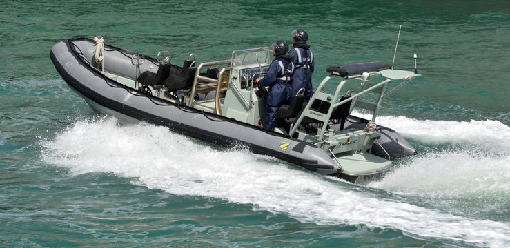 Royal New Zealand Navy Sailors Ride A Zodiak Rigid-hulled Inflat