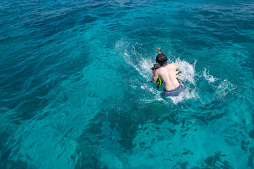 Man jumping to the sea