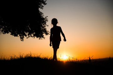 silhouette of a  teen girl 