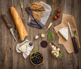 cheese and other ingredients on a wooden table