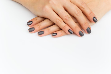 Obraz na płótnie Canvas Woman hands with grey nails