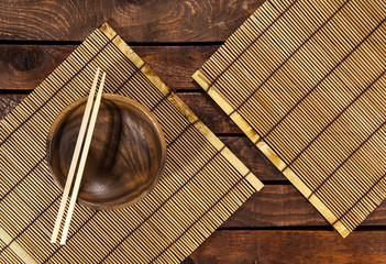 bamboo mat on wooden table. top view