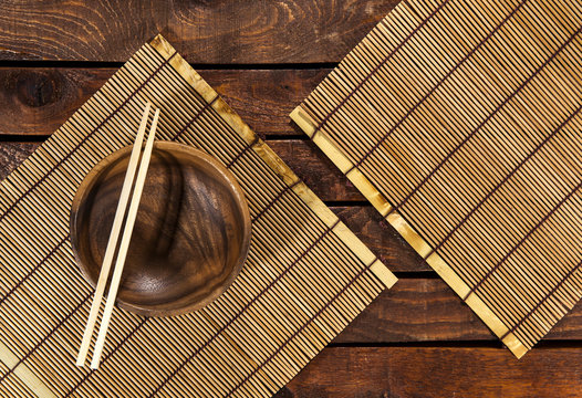 Bamboo Mat On Wooden Table. Top View