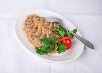 Grilled mashed eggplants with minced tomatoes.