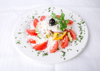 Delicious vegetable salad with grated cheese.