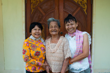 mother and daughter stand in front of the door