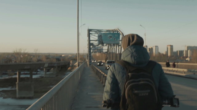 Man walking on the bridge