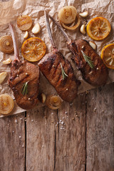 grilled beef steak with rosemary on a paper. vertical top view
