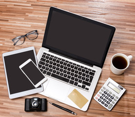 Wood businessman's desk in high definition with laptop, tablet a