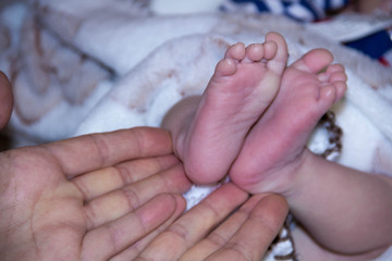 little feet a newborn close