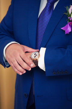 watch on the groom's hand