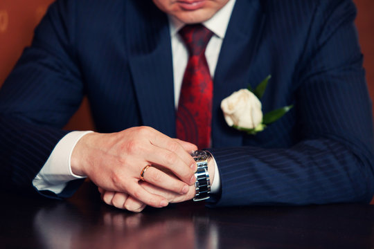 watch on the groom's hand