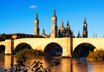 stone bridge and  Cathedral in sunny morning. Zaragoza