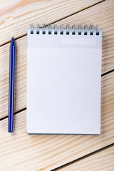 Back to school. Blank note pad, notebook with pen and glasses