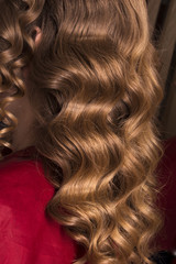 Fototapeta premium strand of curly blond hair on his arm 