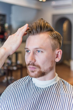 Portrait of man in barber shop