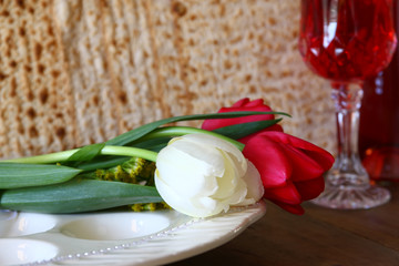 Pesah celebration concept (jewish Passover holiday) with wine and matza
