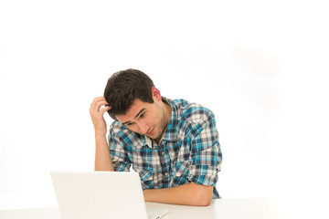 man in check shirt with laptop