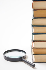 Search with magnifying glass, looking for information in books, blueprints, magazines. Audit...