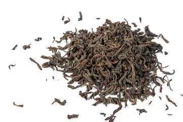 Dry black tea leaves isolated on white background