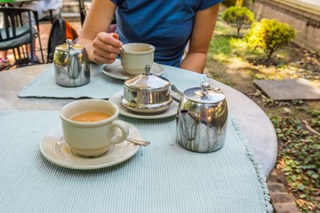 Person enjoying tea.