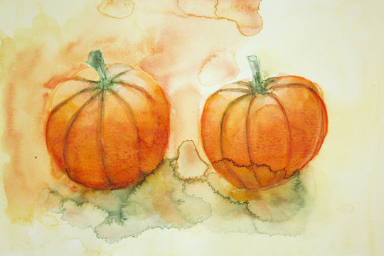 two pumpkins with yellow and orange background. The dabbing technique gives a soft focus effect due to the altered surface roughness of the paper.