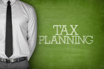 Tax planning text on blackboard 