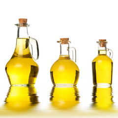 Olive oils three rusty cruets isolated