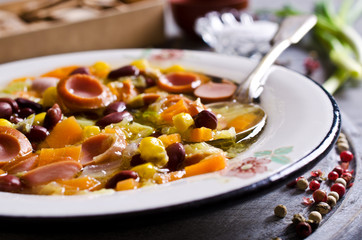 Soup with vegetables and sausages