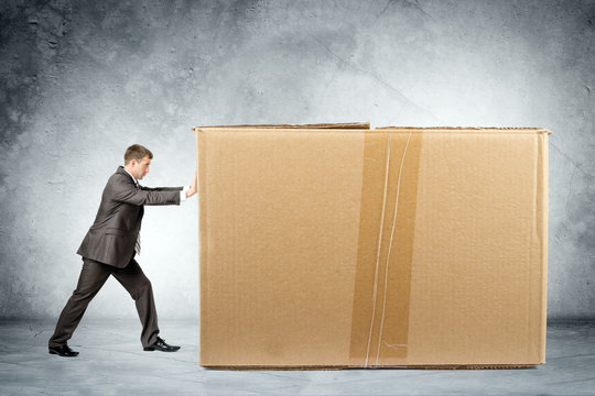 Businessman Pushing Box